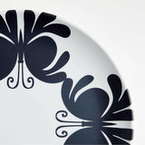 Plato llano de melamina en blanco y negro Butterfly de Lucia Eames.