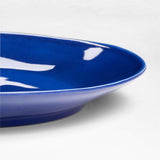 Plato llano de melamina azul oscuro Marin.