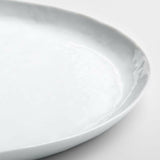 Plato redondo blanco Mercer.