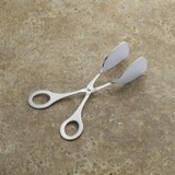 Mini pinzas de servir con mango de tijera.