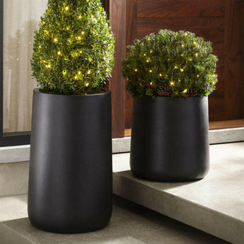 Jardinera alta de fibra de piedra Saabira.