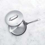 High-quality stainless steel sauté pan ideal for even heat distribution and professional cooking