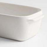 Emile Henry x Crate & Barrel Cream Ceramic Loaf Pan.