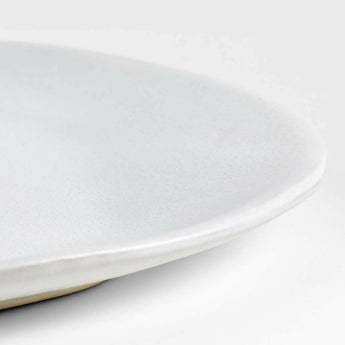 Petals White Stoneware Dinner Plate by Laura Kim.