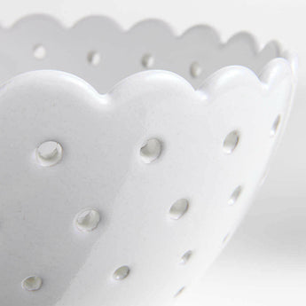 Large White Scallop Eyelet Stoneware Colander by Laura Kim.