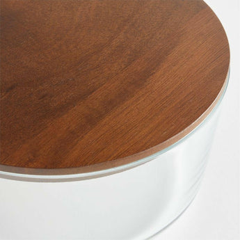 Crate & Barrel 8-Piece Round Glass Storage Containers with Dark Wood Lids.