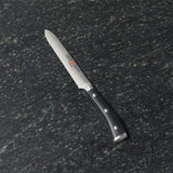 Wüsthof® Classic Ikon 5" Serrated Utility Knife.