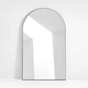 Elegant floor mirror with a wide arched edge, perfect for enhancing interior spaces and adding depth