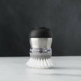 OXO ® Soap Dispensing Palm Dish Brush.