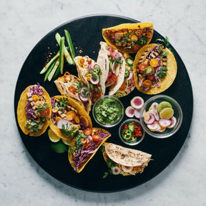 Tabla de servir redonda ebonizada de Tondo.