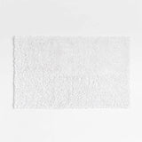 Alfombrilla de baño blanca de algodón orgánico Loop.