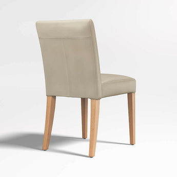 Silla de comedor Lowe Bone Leather con patas de madera natural.