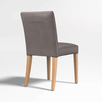 Silla de comedor Lowe Bone Leather con patas de madera natural.