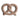 Mordedor de pretzel Baby Mushie