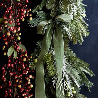 Elegant botanicals displayed in stylish vases from Crate & Barrel, perfect for modern home decor.
