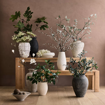 Elegant Faux botanicals arranged in stylish crates from Crate & Barrel, perfect for sophisticated home decor