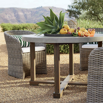 Abaco Resin Wicker Outdoor Dining Chair with White Sand Sunbrella ® Cushion.