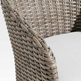 Abaco Resin Wicker Outdoor Dining Chair with White Sand Sunbrella ® Cushion.