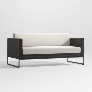 Dune Black Outdoor Sofa with White Cushions.