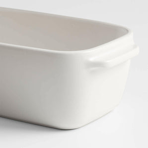 Emile Henry x Crate & Barrel Cream Ceramic Loaf Pan.
