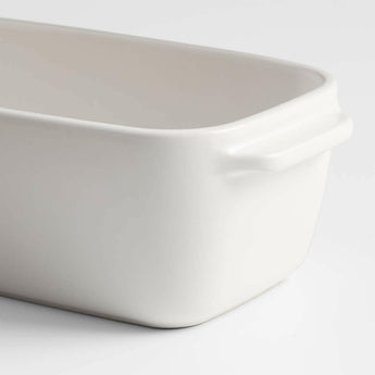 Emile Henry x Crate & Barrel Cream Ceramic Loaf Pan.