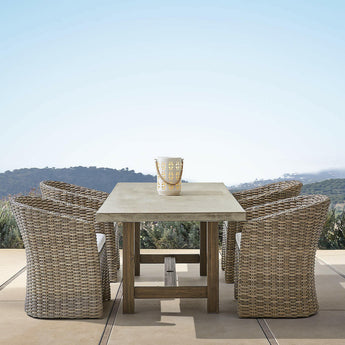 Abaco Resin Wicker Outdoor Dining Chair with White Sand Sunbrella ® Cushion.