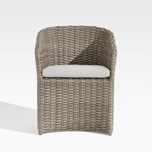 Abaco Resin Wicker Outdoor Dining Chair with White Sand Sunbrella ® Cushion.