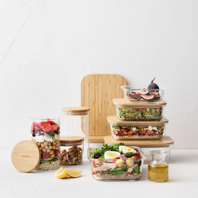Glass food storage containers with wooden lids and cutting boards for meal preparation and food storage_Crate&Barrel