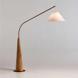Gibson Wood Hanging Arc Floor Lamp with White Shade.