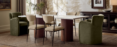 Dining table with green armchairs and light dining chairs in a Mix & Match arrangement_Crate&Barrel Costa Rica