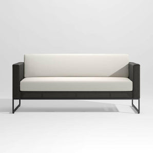 Dune Black Outdoor Sofa with White Cushions.