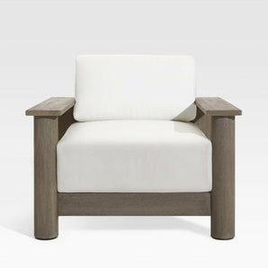Ashore Grey Wood Outdoor Lounge Chair with White Cushions.